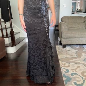 Long black lace skirt. Lacing up the side.